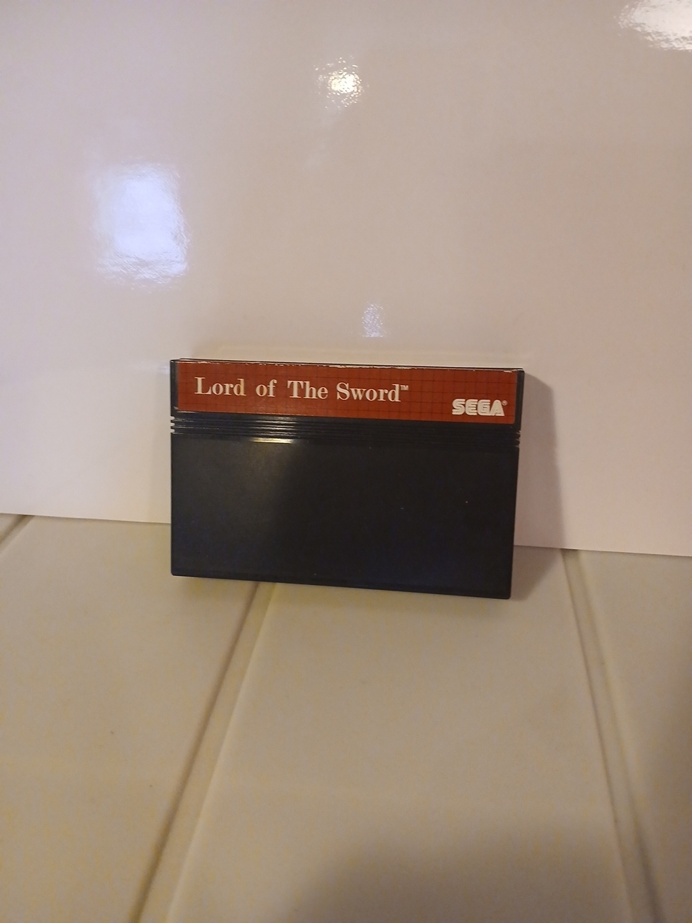 Sega "Lord of The Sword" Game Cartridge - Red & Black Master System
